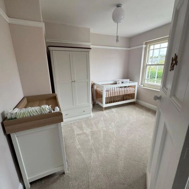 fluffy beige carpet in neutral modern nursery