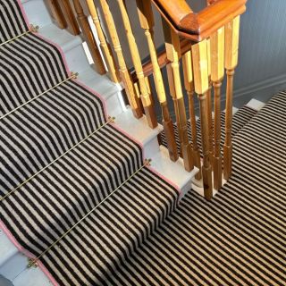 Lerwick in black cream stripe with brass stair rods and bubblegum pink whipping